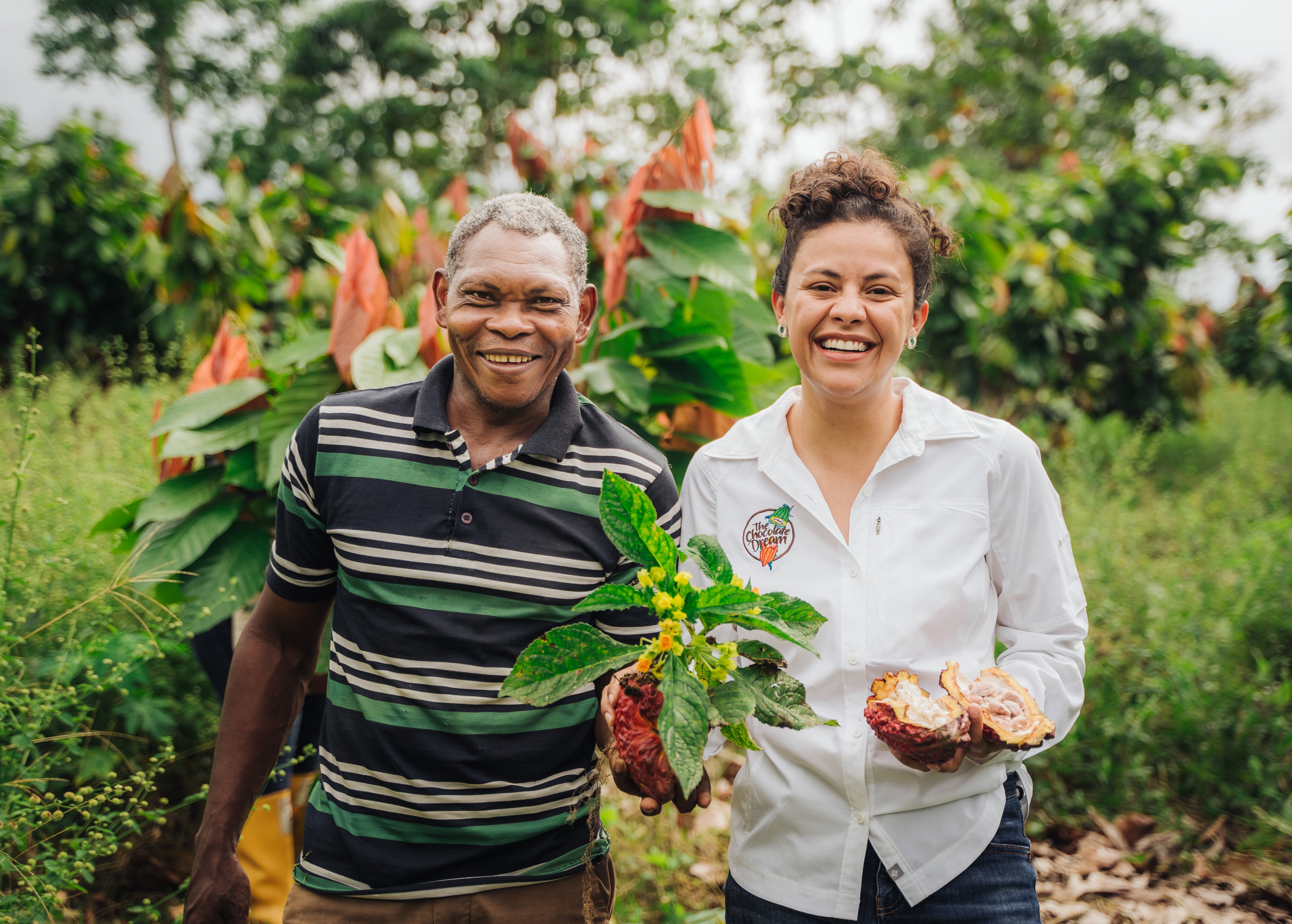 Field visits to Tumaco cocoa farms. Luker team member with cocoa farmer.